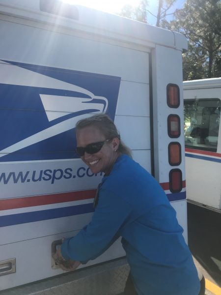 Mail carrier with hearing loss from chronic ear infections with mail truck