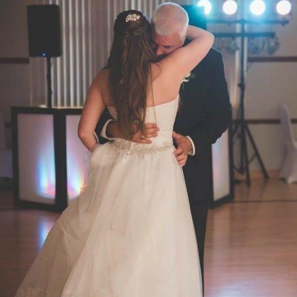 Dante dancing with daughter at her wedding prior to decision to get a cochlear implant