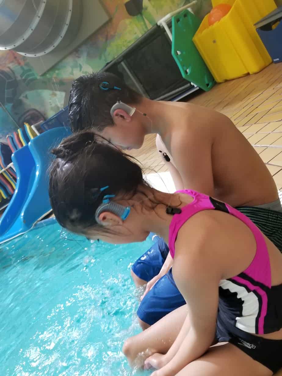 Siblings with severe to profound sensorineural hearing loss at the pool