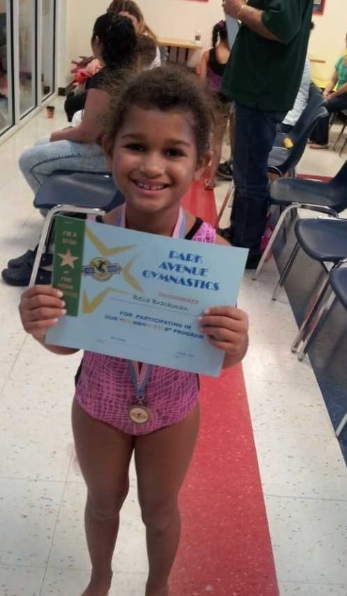 Bella, star in gymnastics with hearing loss