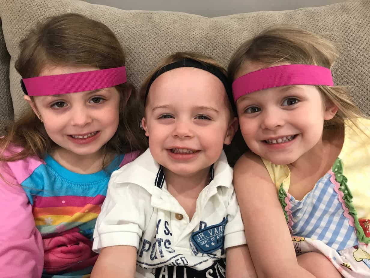 Jackson with microtia and atresia with siblings