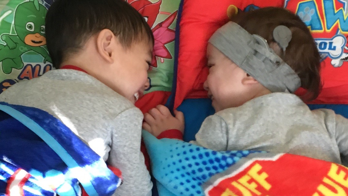 Shane, born with hearing loss, with his brother