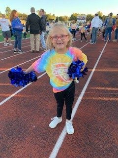 Child born premature, cheerleading with her cochlear implants
