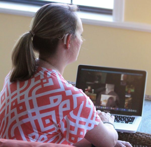Holly uses her cochlear implant's technology for her distance learning lessons and interactions.
