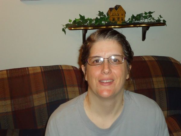 Lori smiling because she has better hearing with her cochlear implants