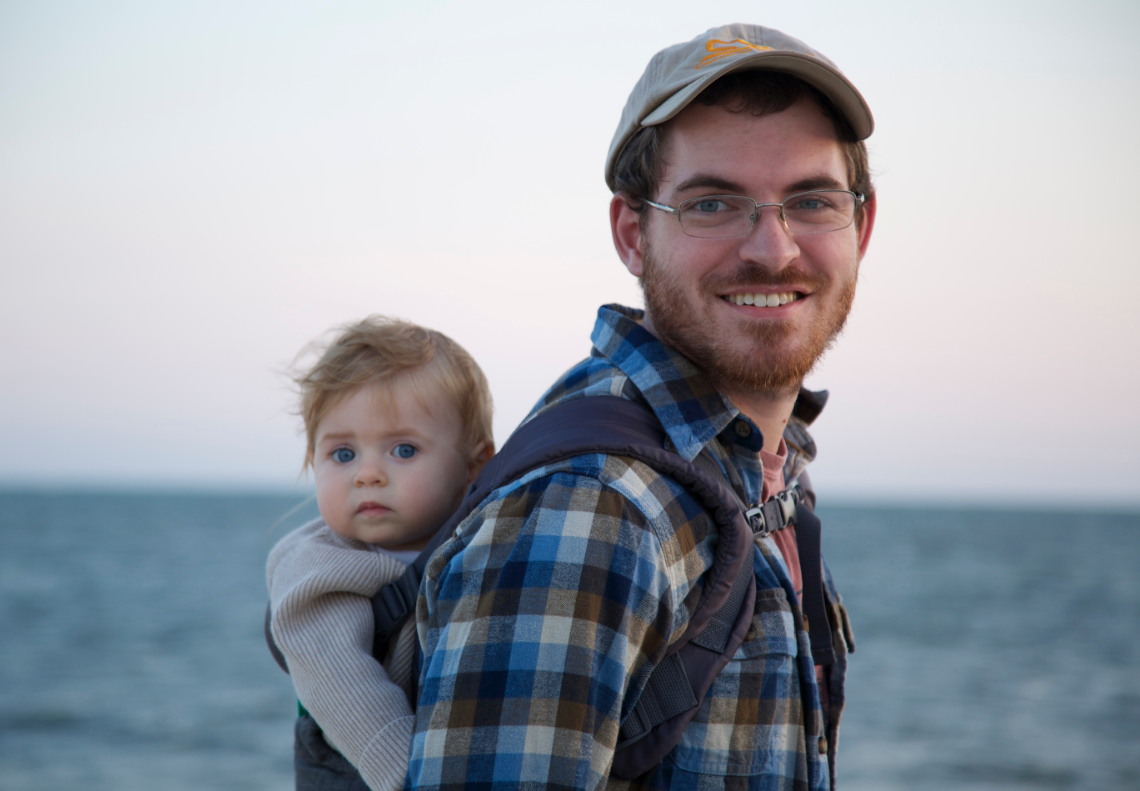 Tyler, who describes how his cochlear implants gave him confidence, with his child