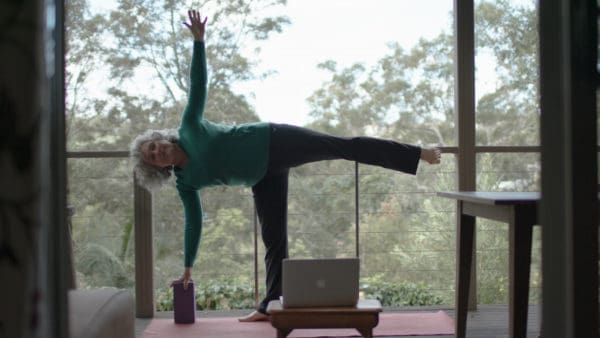 Sue doing yoga with Cochlear Nucleus 7 Sound Processor upgrade