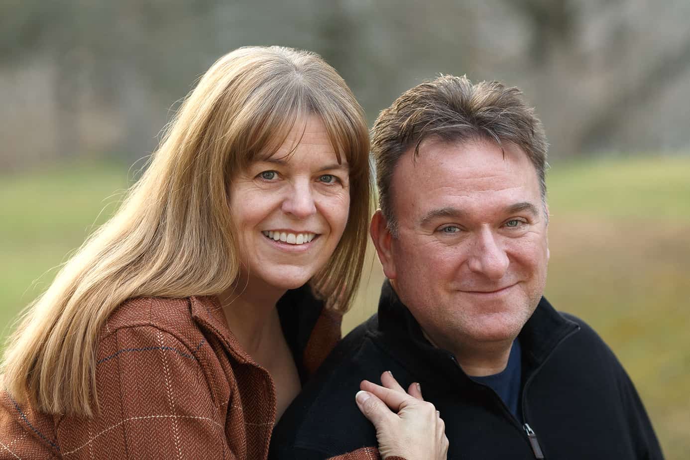 Kim, a woman with single-sided profound hearing loss, with her husband