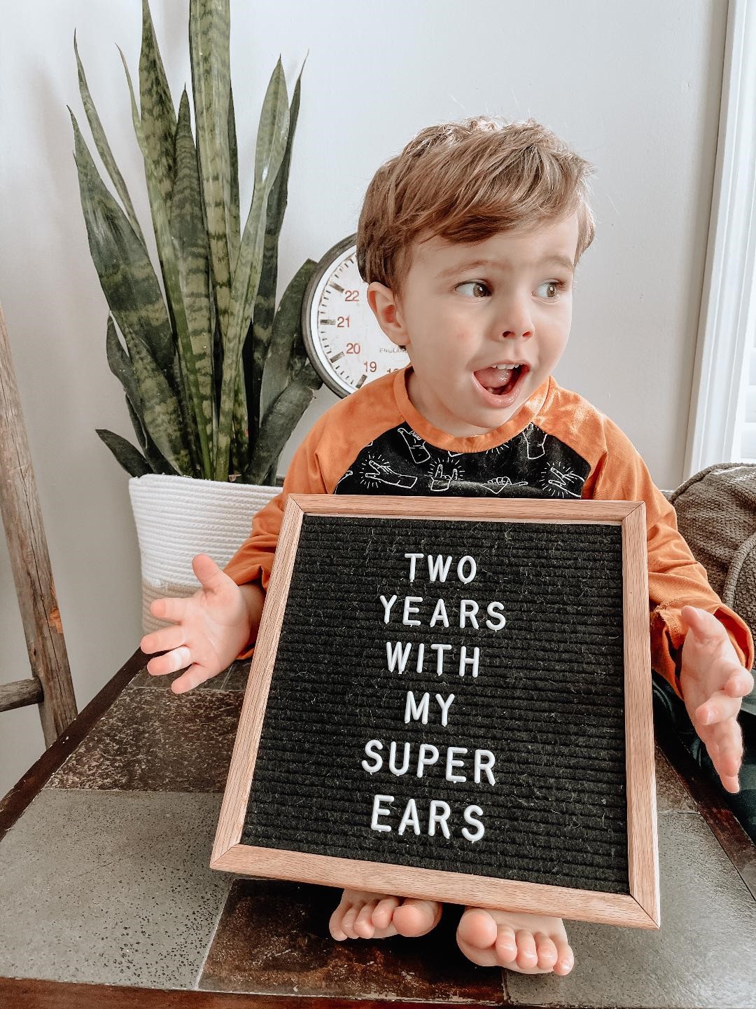Child born with significant hearing loss with his cochlear implants